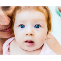 red hair, blue eyed baby girl with her mom